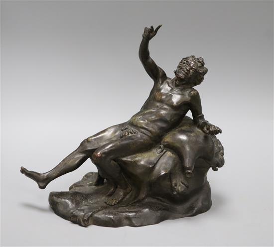 A bronze of a reclining man height 24cm